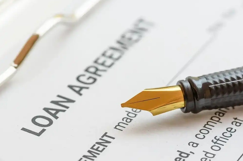 Pen on top of a loan agreement