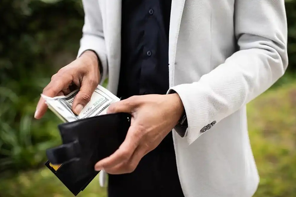 Putting money in wallet after payday