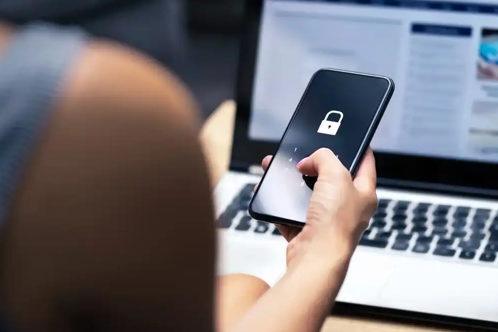 A woman unlocking her smartphone