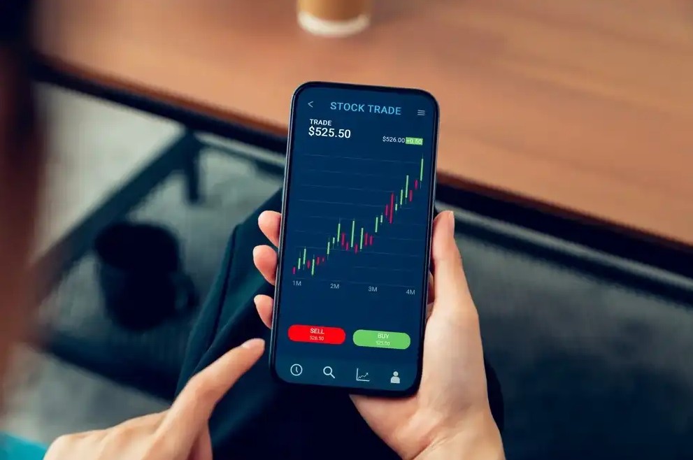 Someone investing in stocks on phone