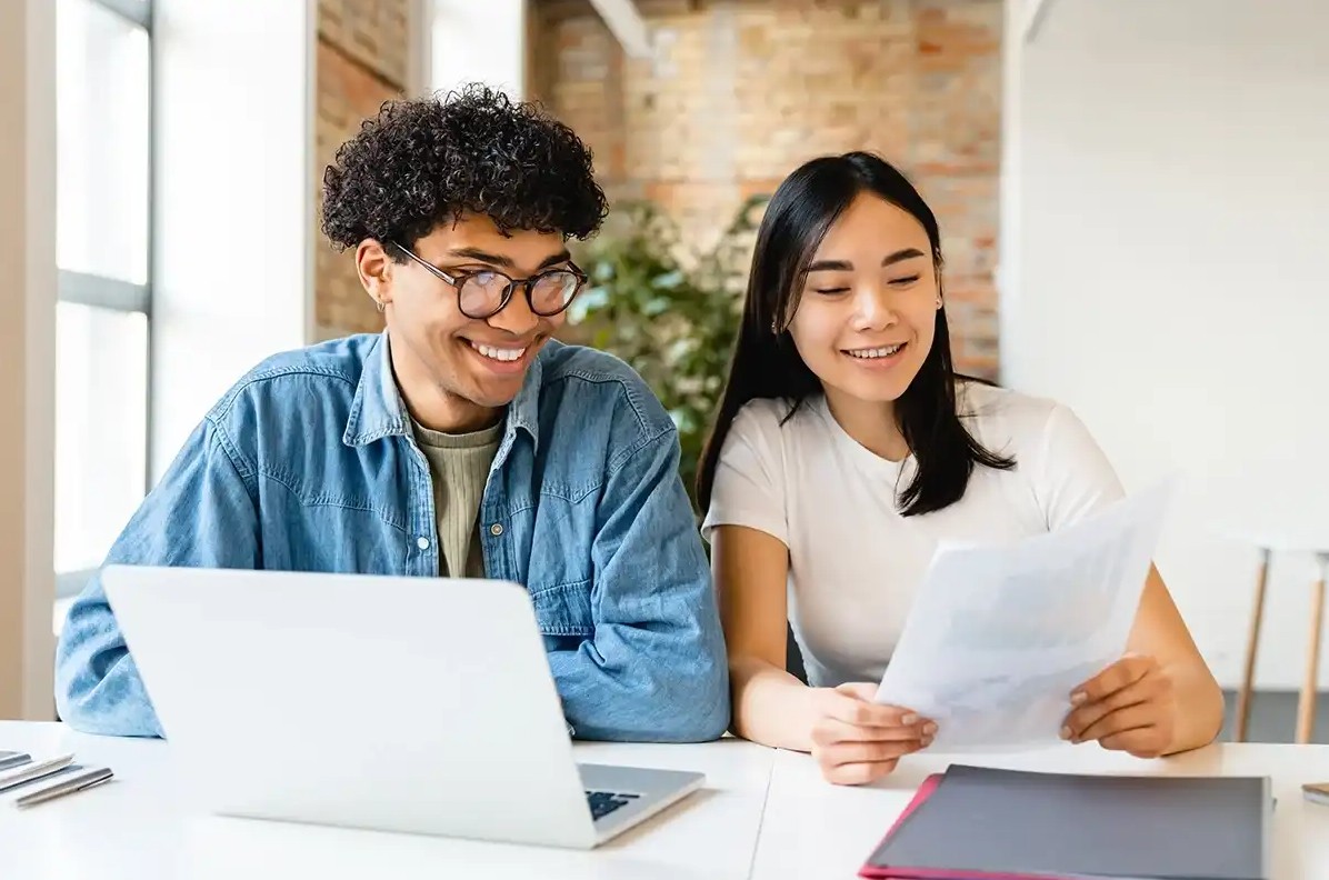 A couple looking up their student loan repayment options