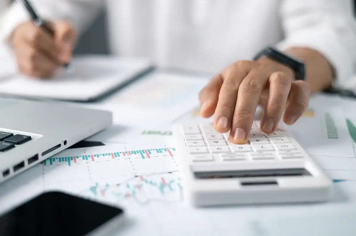 Man calculating taxes for next season