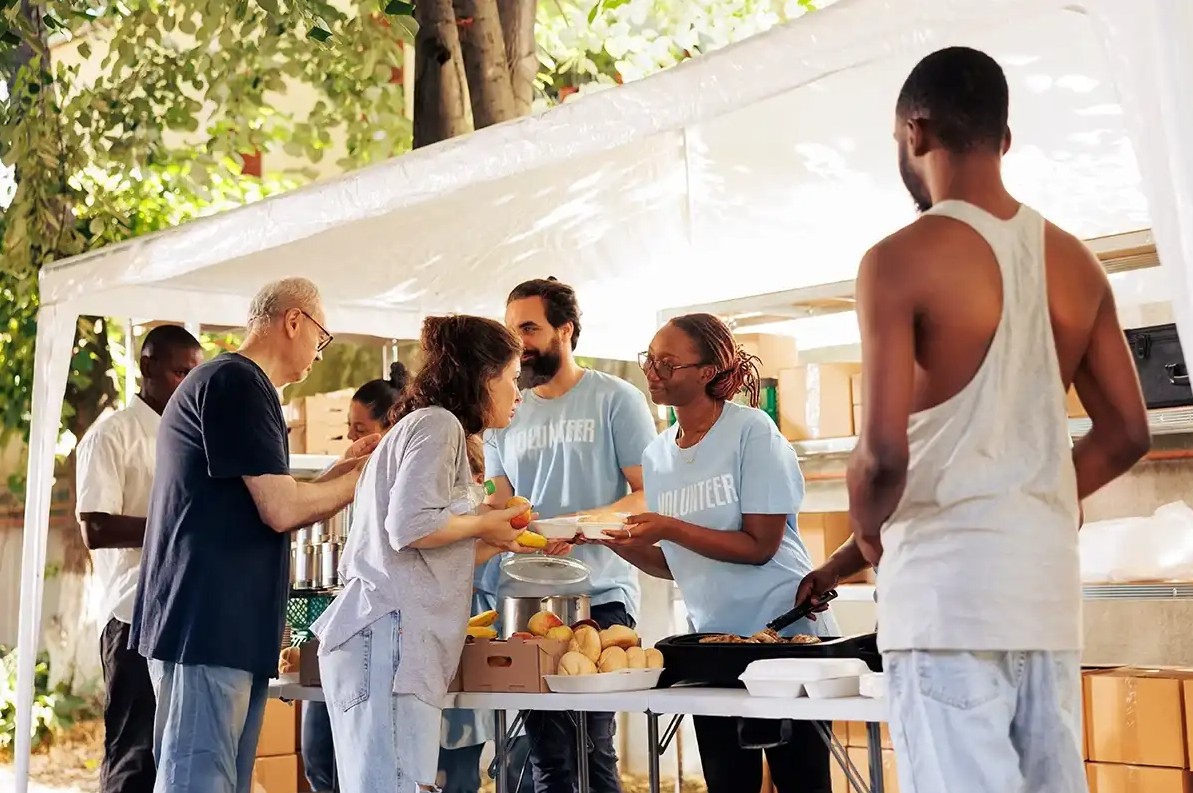 People giving out food at foodbank
