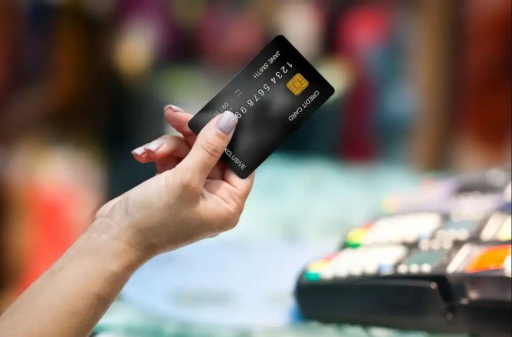 Person using the credit card they applied for