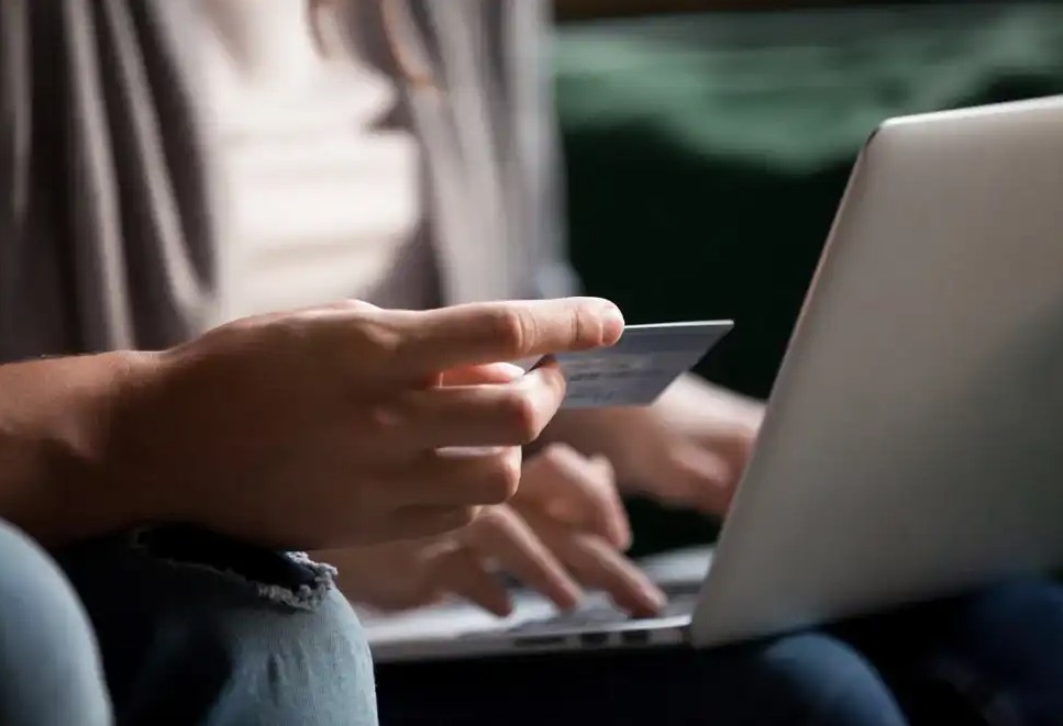 Someone using a prepaid card to shop online