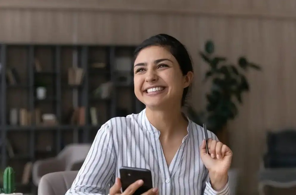 A woman shopping online with prepaid card